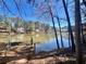 Picturesque view of the lake with a wooden dock and swing at 4811 West Lake Se Dr, Conyers, GA 30094