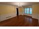 Bright living room with hardwood floors, crown molding and large window at 4811 West Lake Se Dr, Conyers, GA 30094