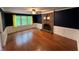 Cozy living room with fireplace, hardwood floors, and natural light at 4811 West Lake Se Dr, Conyers, GA 30094