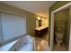 Bathroom showcasing a corner tub and double sink vanity at 4811 West Lake Se Dr, Conyers, GA 30094