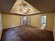 Spacious main bedroom with tray ceiling, ceiling fan, and neutral paint at 4811 West Lake Se Dr, Conyers, GA 30094