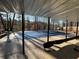 A lake view can be seen from the covered backyard pool and patio space at 4811 West Lake Se Dr, Conyers, GA 30094