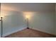Cozy carpeted room featuring soft lighting from two lamps at 4811 West Lake Se Dr, Conyers, GA 30094