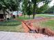 Landscaped yard with a new drainage system ensures proper water management for lush greenery at 4811 West Lake Se Dr, Conyers, GA 30094