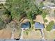 Aerial view of the property showcasing the home, driveway, surrounding trees and well-maintained yards at 2587 Lancaster Dr, Atlanta, GA 30344