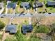 Birds-eye view of home, revealing its location, roof, driveway, street, and surrounding greenery at 2587 Lancaster Dr, Atlanta, GA 30344