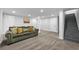 Finished basement featuring plush carpeting, recessed lighting, and a comfortable olive green sofa at 2587 Lancaster Dr, Atlanta, GA 30344