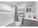 Bathroom features a modern vanity, tiled shower, and a decorative mirror, providing a sleek and functional space at 2587 Lancaster Dr, Atlanta, GA 30344