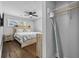Modern bedroom with a ceiling fan, wood floors, natural light, and walk in closet at 2587 Lancaster Dr, Atlanta, GA 30344