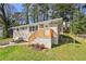 Charming brick home with a welcoming front porch and freshly painted wooden railing at 2587 Lancaster Dr, Atlanta, GA 30344
