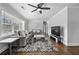 Bright living room featuring hardwood floors, ceiling fan and neutral decor at 2587 Lancaster Dr, Atlanta, GA 30344