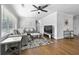 Bright living room featuring hardwood floors, ceiling fan and neutral decor at 2587 Lancaster Dr, Atlanta, GA 30344