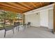 Enclosed sunroom featuring a seating area with access to the backyard at 2587 Lancaster Dr, Atlanta, GA 30344