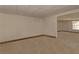 Unfinished basement area featuring concrete flooring and neutral walls, ready for customization at 3000 Gallery Walk, Snellville, GA 30039