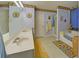 Bright bathroom features a tub, sunflower wallpaper, sink and vanity, a shower, and natural light at 3000 Gallery Walk, Snellville, GA 30039