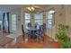 Cozy breakfast nook with a round table, four chairs, and a view to the backyard at 3000 Gallery Walk, Snellville, GA 30039