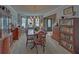 Elegant dining room with a wooden table set for six, a chandelier, and traditional decor at 3000 Gallery Walk, Snellville, GA 30039