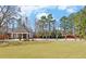 Beautiful community lawn and picnic area with mature trees and landscaping creating a serene outdoor atmosphere at 3000 Gallery Walk, Snellville, GA 30039