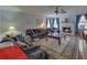 Spacious living room with a fireplace, plush furniture, and a ceiling fan at 3000 Gallery Walk, Snellville, GA 30039