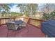 Outdoor patio area with a table, chairs, and a grill for entertainment at 3000 Gallery Walk, Snellville, GA 30039