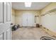 Unfinished basement with double doors and ample storage space at 3211 Blaisdell Rd, Buford, GA 30519
