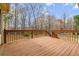 Wooden deck with railings, perfect for outdoor entertaining at 3211 Blaisdell Rd, Buford, GA 30519