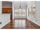 Inviting dining area featuring hardwood floors, natural light, and direct access to the kitchen at 3211 Blaisdell Rd, Buford, GA 30519