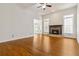 Spacious living room with hardwood floors and a cozy fireplace, creating a warm and inviting atmosphere at 3211 Blaisdell Rd, Buford, GA 30519