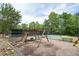 Playground area featuring climbing equipment, swings, and a tennis court at 3211 Blaisdell Rd, Buford, GA 30519