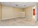 Neutral-toned room featuring carpeted floors and a single ceiling light at 3211 Blaisdell Rd, Buford, GA 30519
