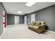 Neutral room featuring carpeted floors, a couch, and recessed ceiling lights at 3211 Blaisdell Rd, Buford, GA 30519