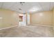 Open floor plan room with carpeted floors and multiple doorways at 3211 Blaisdell Rd, Buford, GA 30519