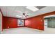 Spacious room featuring carpeted floors, a ceiling fan, and ample natural light at 3211 Blaisdell Rd, Buford, GA 30519