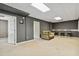 Well-lit room with carpeted floors, a comfortable sofa, and adjacent doorways at 3211 Blaisdell Rd, Buford, GA 30519