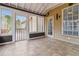 Enclosed sunroom with tile floor and screens leading to a deck at 3211 Blaisdell Rd, Buford, GA 30519