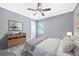 Bright bedroom features neutral walls, soft carpet, a ceiling fan, and a stylish decor for a relaxing ambiance at , Atlanta, GA 30315