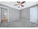 Comfortable bedroom with neutral walls, carpet, ceiling fan, and easy access to the kitchen at , Atlanta, GA 30315
