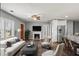 Open-concept living room with fireplace, stainless steel appliances, and bar seating at , Atlanta, GA 30315