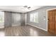 Open living space featuring wood floors, natural light, and sliding barn doors at , Atlanta, GA 30315