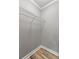 Neutral closet includes a built in shelf and natural flooring with clean trim at 1508 Wingate Way, Atlanta, GA 30350