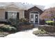 Community clubhouse with stone accents, professional landscaping and brick walkway at 1508 Wingate Way, Atlanta, GA 30350