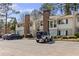Attractive condo with charming exterior, chimney, well-maintained landscaping, and convenient parking at 1508 Wingate Way, Atlanta, GA 30350