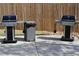 Two stainless steel grills on a concrete patio with a convenient trash can nearby at 1508 Wingate Way, Atlanta, GA 30350