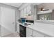 Updated kitchen features white cabinets and countertops at 1508 Wingate Way, Atlanta, GA 30350