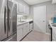 The updated kitchen features stainless steel appliances and ample counter space at 1508 Wingate Way, Atlanta, GA 30350