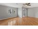 Bright living room showcasing hardwood floors, updated ceiling fan, fresh paint, and natural light at 1508 Wingate Way, Atlanta, GA 30350