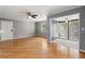 Bright living room with hardwood floors leads into a sunroom with natural light at 1508 Wingate Way, Atlanta, GA 30350
