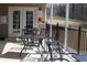 Comfortable clubhouse patio has tables with chairs and a beautiful view of nature at 1508 Wingate Way, Atlanta, GA 30350