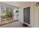 Private porch with gray front door and a peek at the attractive landscaping at 1508 Wingate Way, Atlanta, GA 30350
