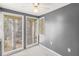 Cozy sun room with natural light, ceiling fan, and neutral paint at 1508 Wingate Way, Atlanta, GA 30350